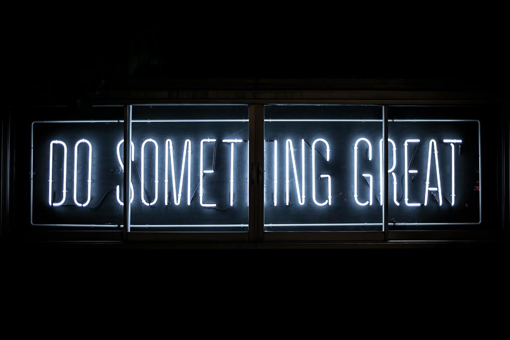 Image of white neon sign with the t3ext :do something great: