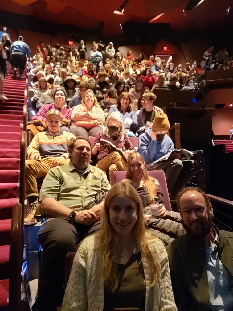 Image of people in the audience at a theater.