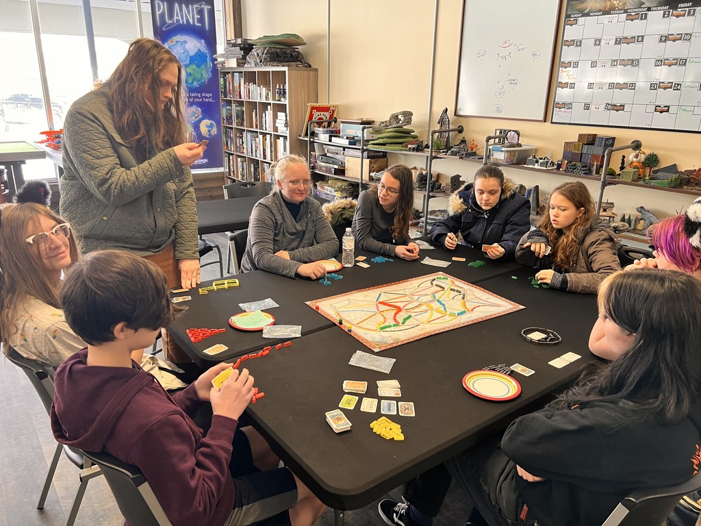 A group of students playing a board game