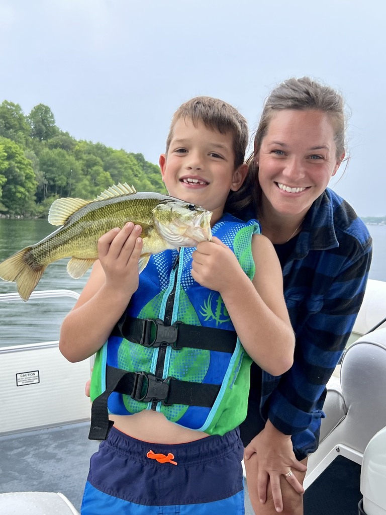 young boy with fish and mom